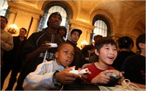 Kids enjoyed video games on Wii, Xbox 360 and Playstation 3 at the main branch of the New York Public Library on Friday. (Photos: Suzanne DeChillo/The New York Times)